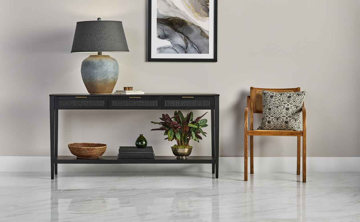 Glossy tile in foyer with side table and chair 